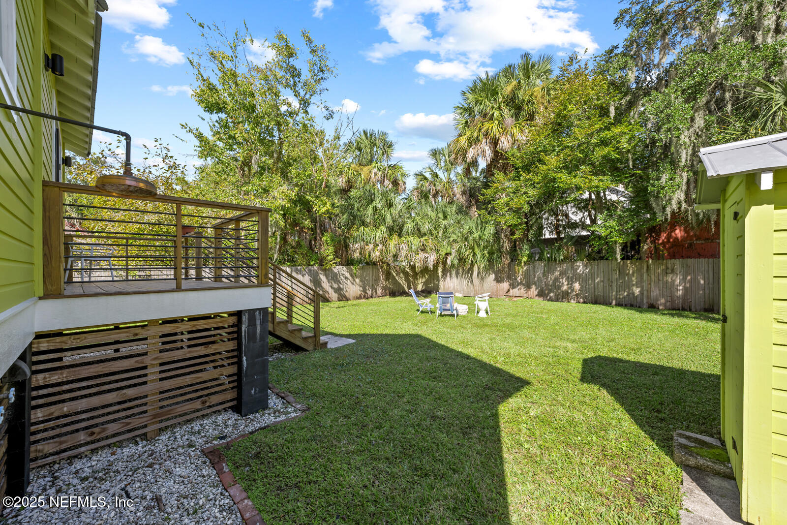 179 Blanco Street St. Augustine, FL 32084 - Photo 37 of 56 a view of a garden with trees in the background