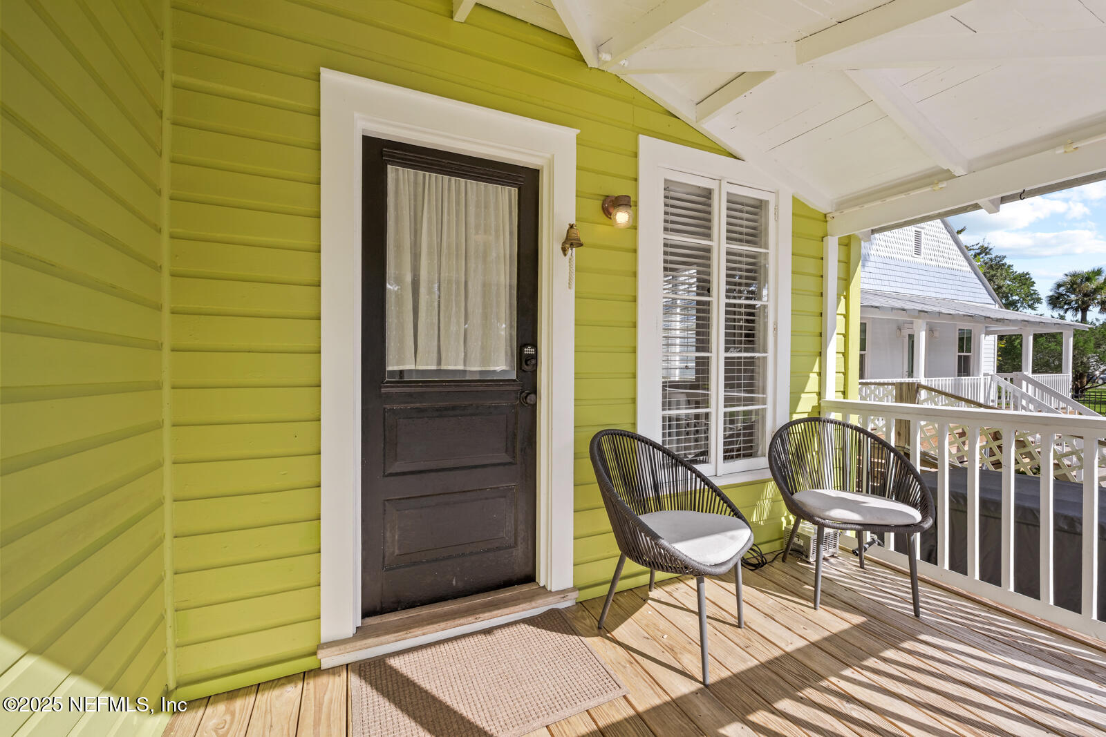 179 Blanco Street St. Augustine, FL 32084 - Photo 4 of 56 a view of a door with a chair and a couch