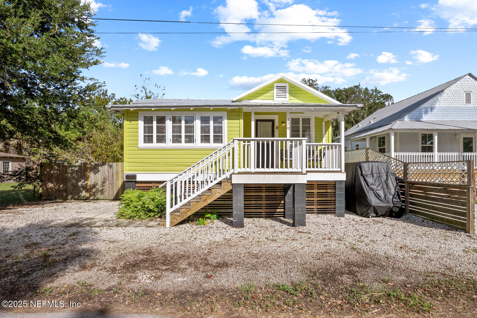 179 Blanco Street St. Augustine, FL 32084 - Photo 42 of 56 a front view of a house with a yard
