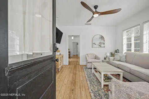 a view of a balcony and wooden floor