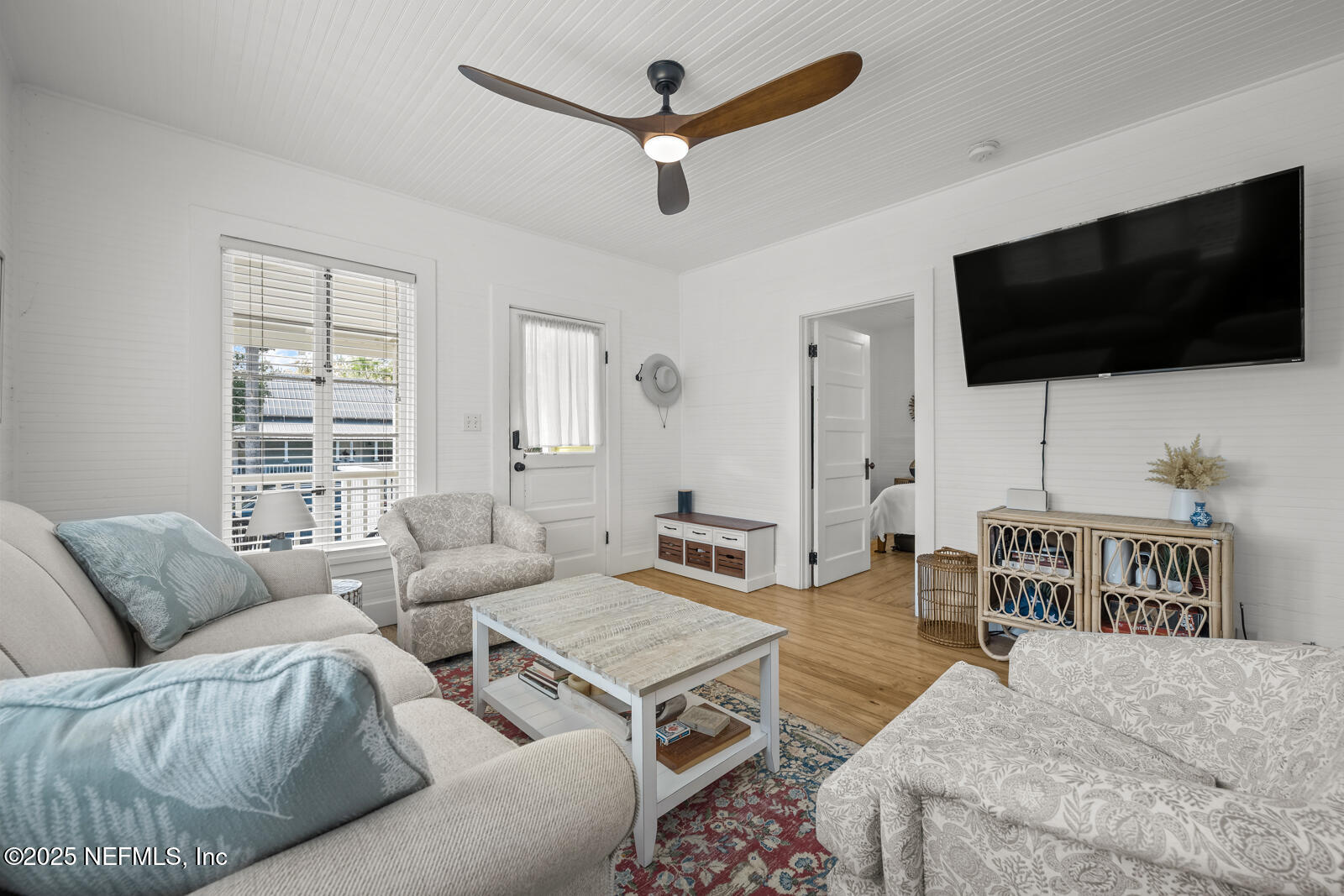 179 Blanco Street St. Augustine, FL 32084 - Photo 8 of 56 a living room with furniture and a flat screen tv