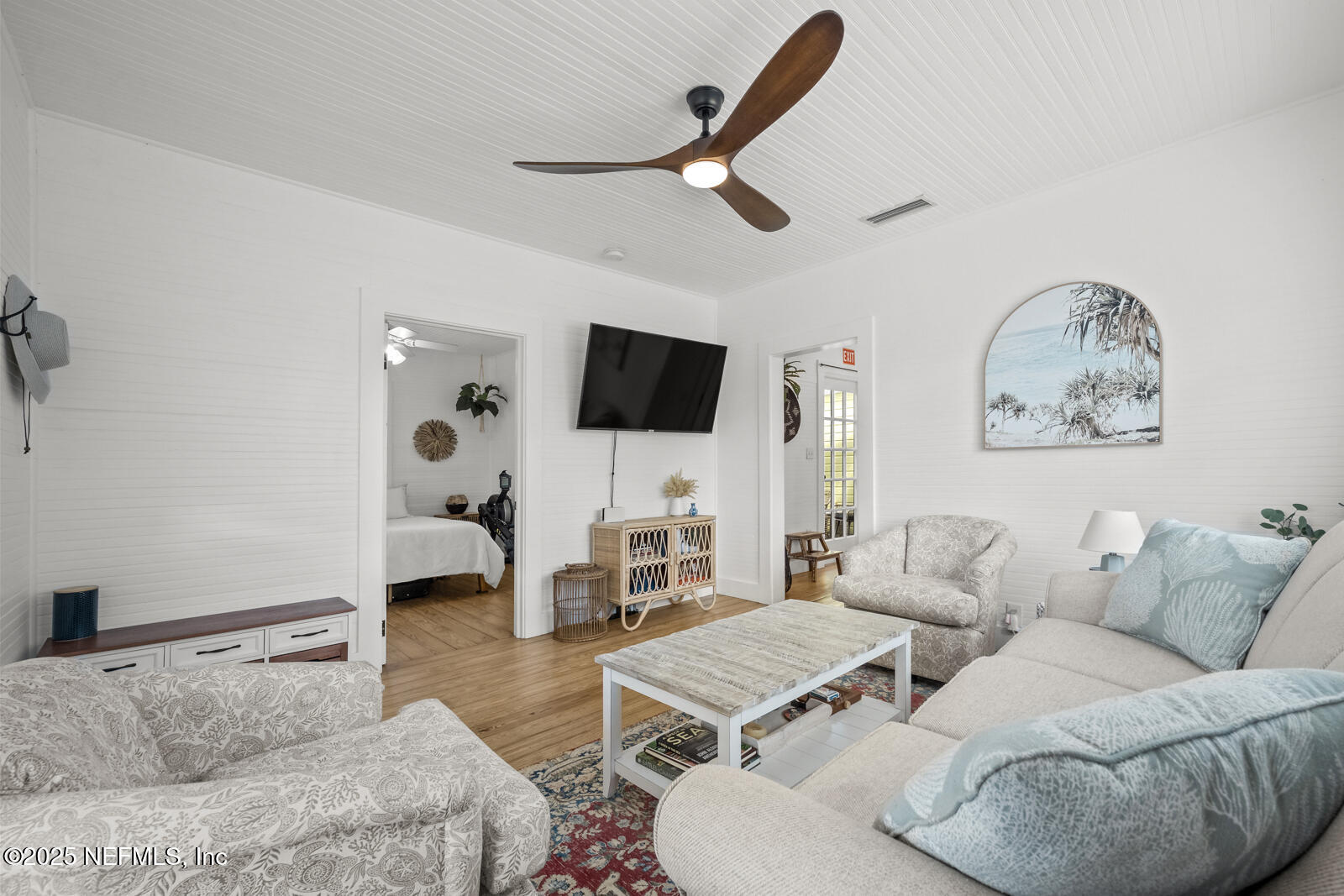 179 Blanco Street St. Augustine, FL 32084 - Photo 9 of 56 a living room with furniture and a flat screen tv