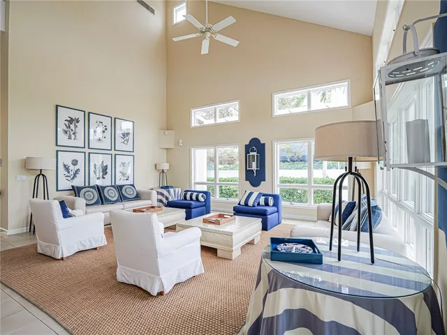 a living room with fireplace furniture and a table