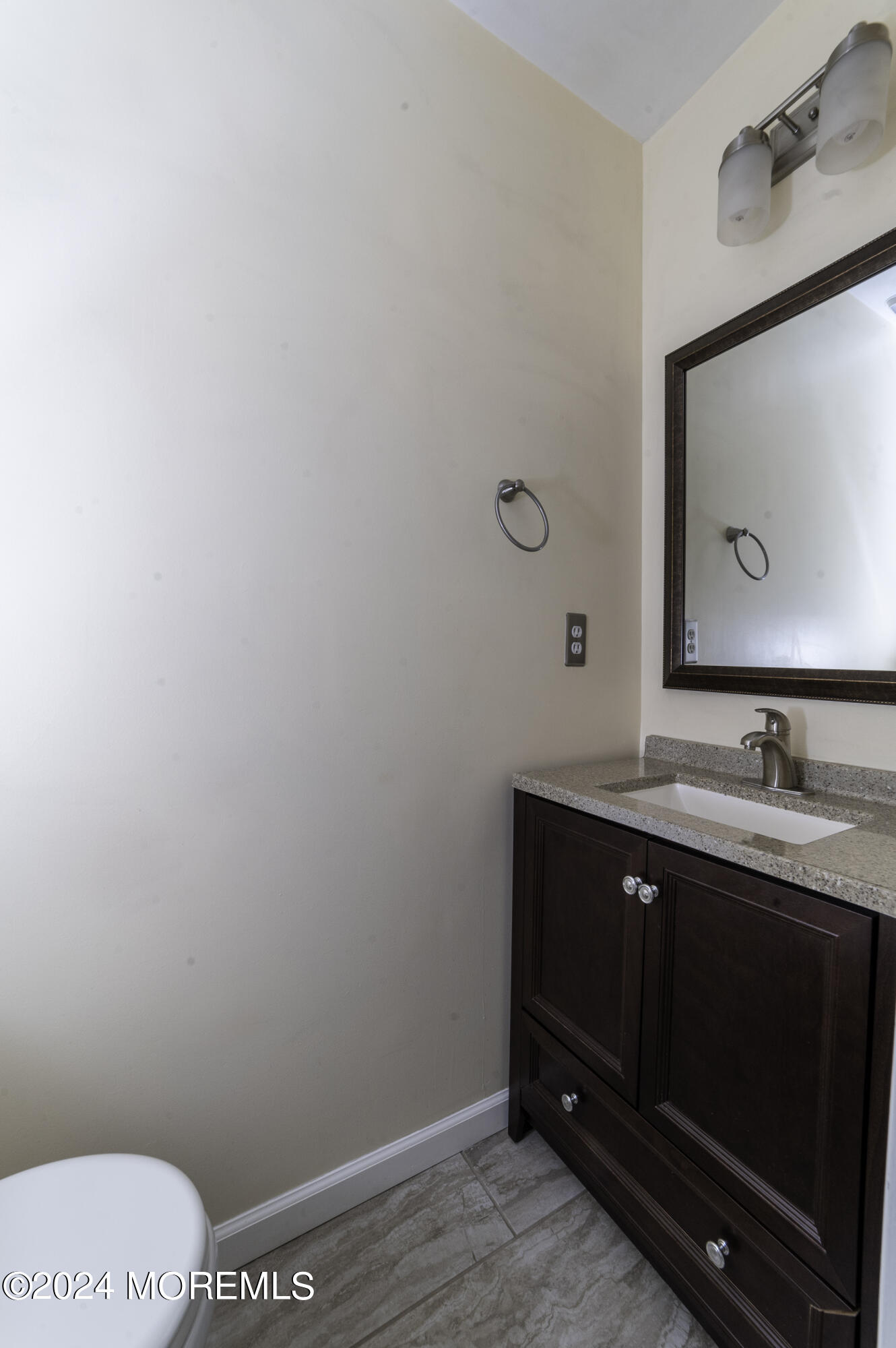 179 Wells Mill Road Waretown, NJ 08758 - Photo 11 of 28 a bathroom with a toilet sink and mirror