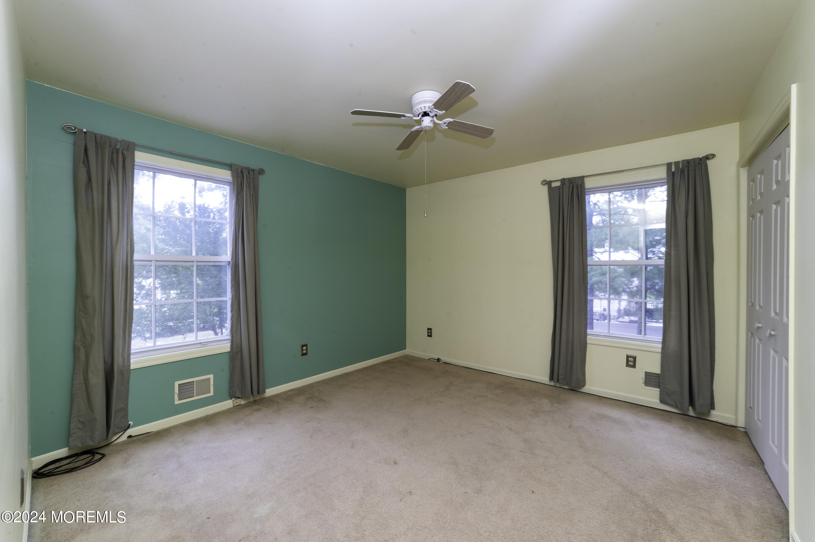 179 Wells Mill Road Waretown, NJ 08758 - Photo 20 of 28 a view of an empty room with a window and a kitchen