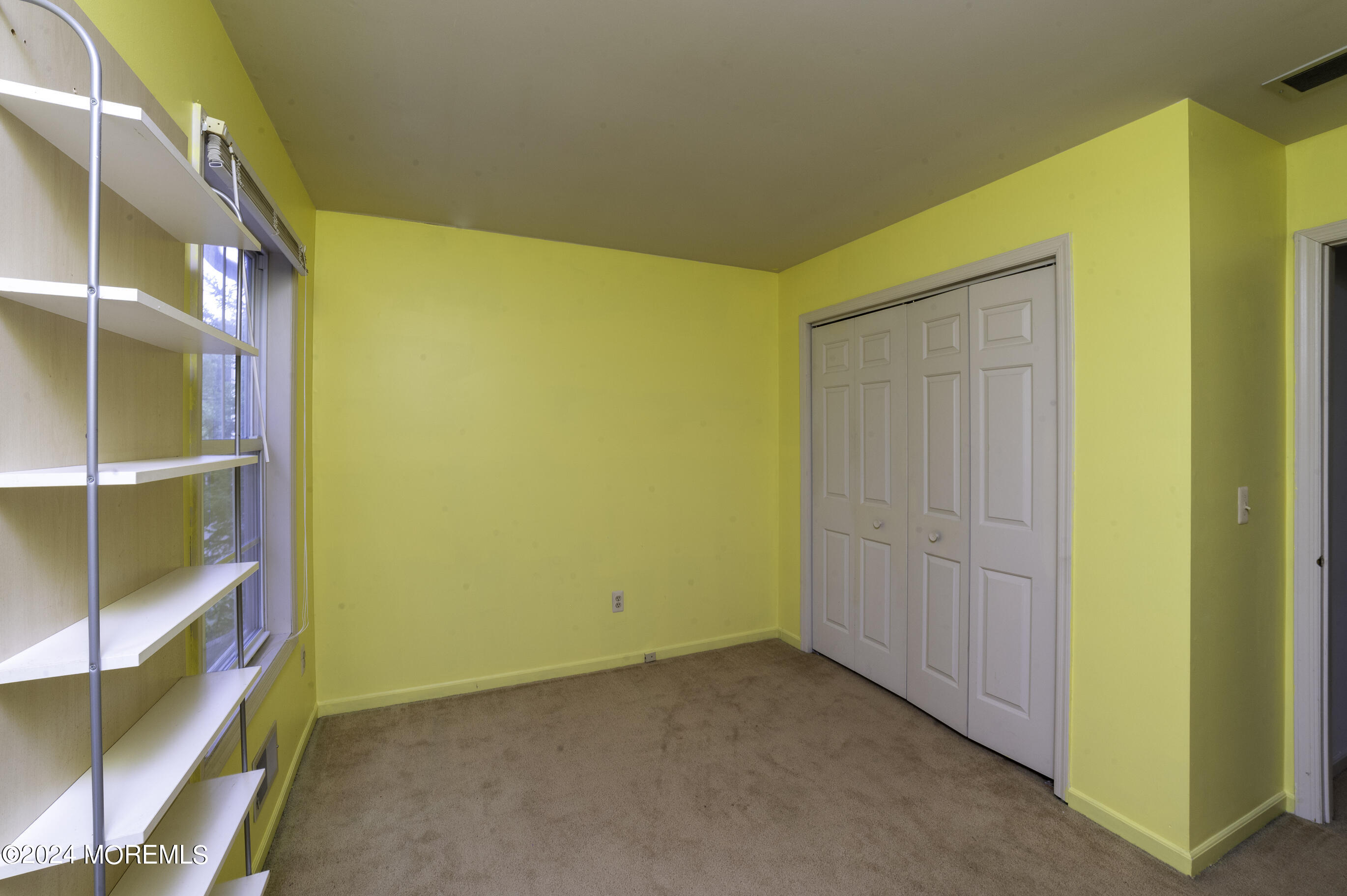 179 Wells Mill Road Waretown, NJ 08758 - Photo 21 of 28 a view of a big room with closet and wooden floor