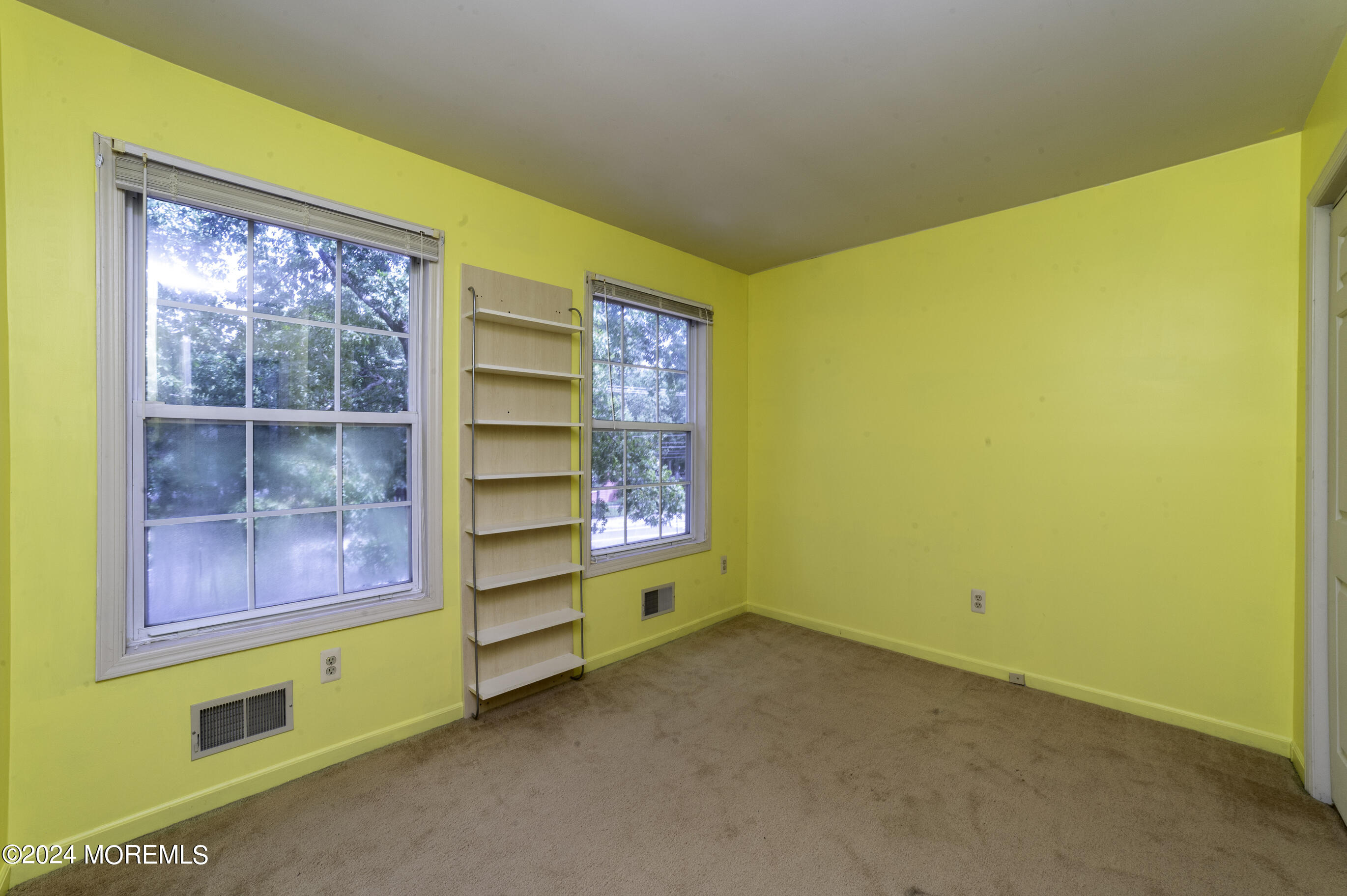 179 Wells Mill Road Waretown, NJ 08758 - Photo 22 of 28 a room with a bed and painted walls
