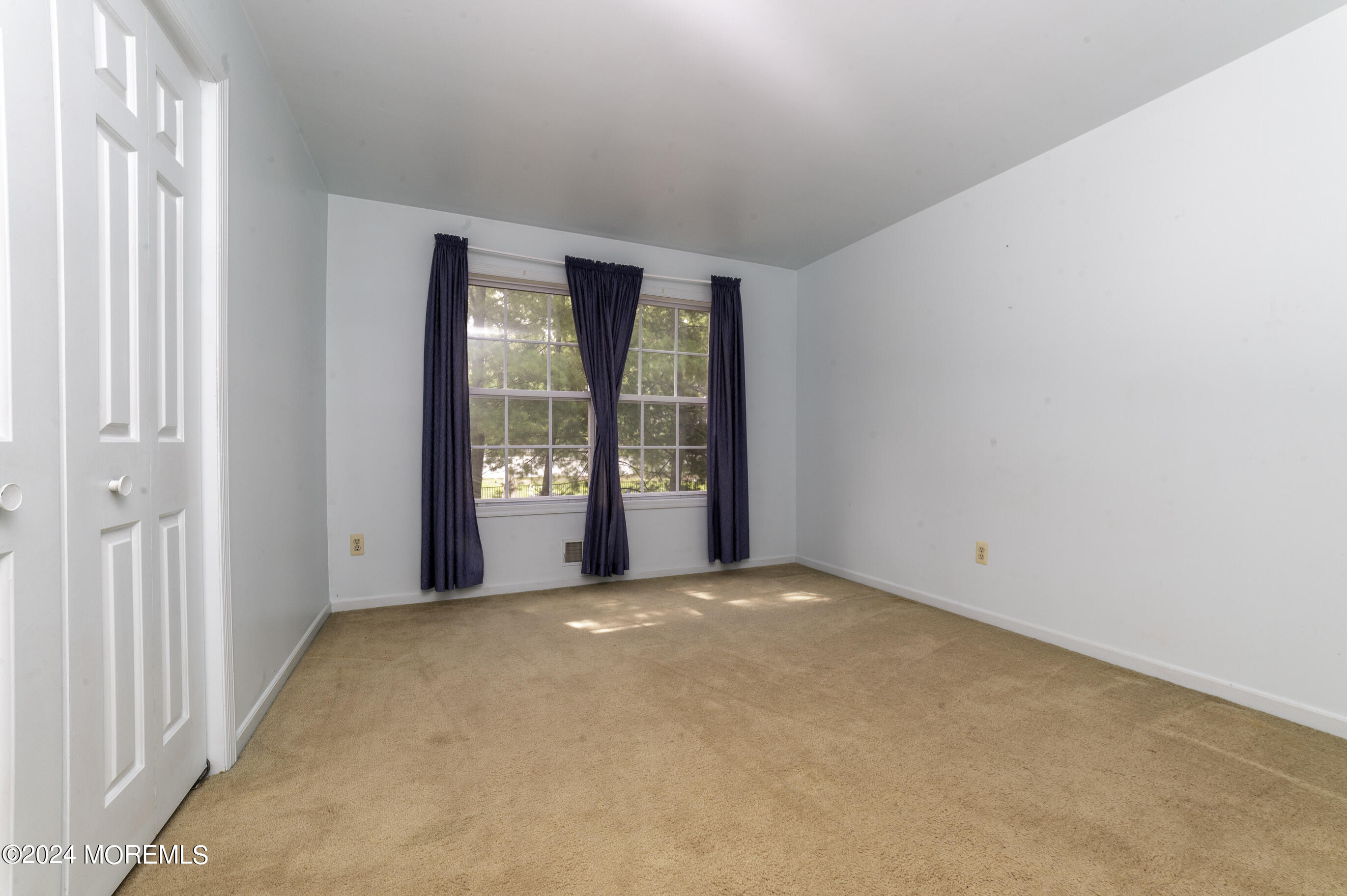 179 Wells Mill Road Waretown, NJ 08758 - Photo 25 of 28 a view of an empty room with a window