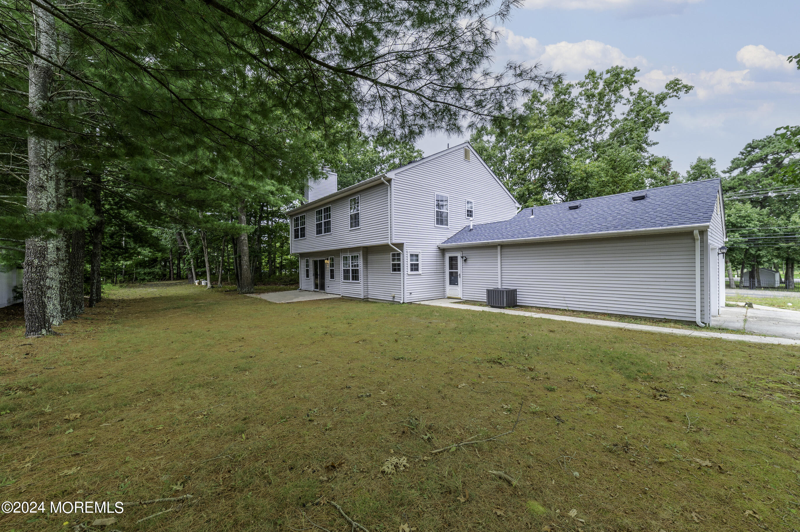 179 Wells Mill Road Waretown, NJ 08758 - Photo 27 of 28 a view of a house with pool and tree s