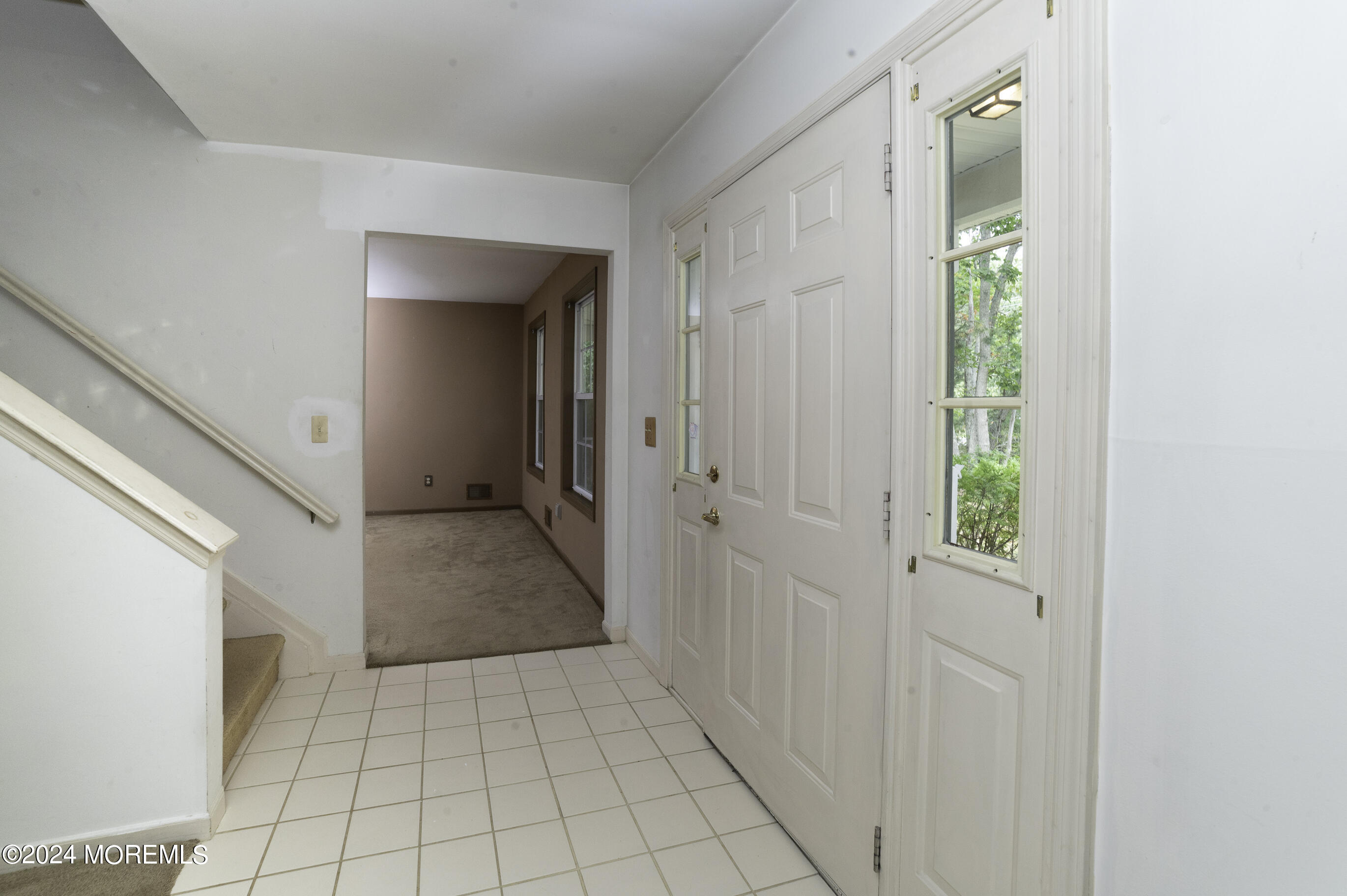 179 Wells Mill Road Waretown, NJ 08758 - Photo 5 of 28 a view of a hallway with wooden floor and a bathroom