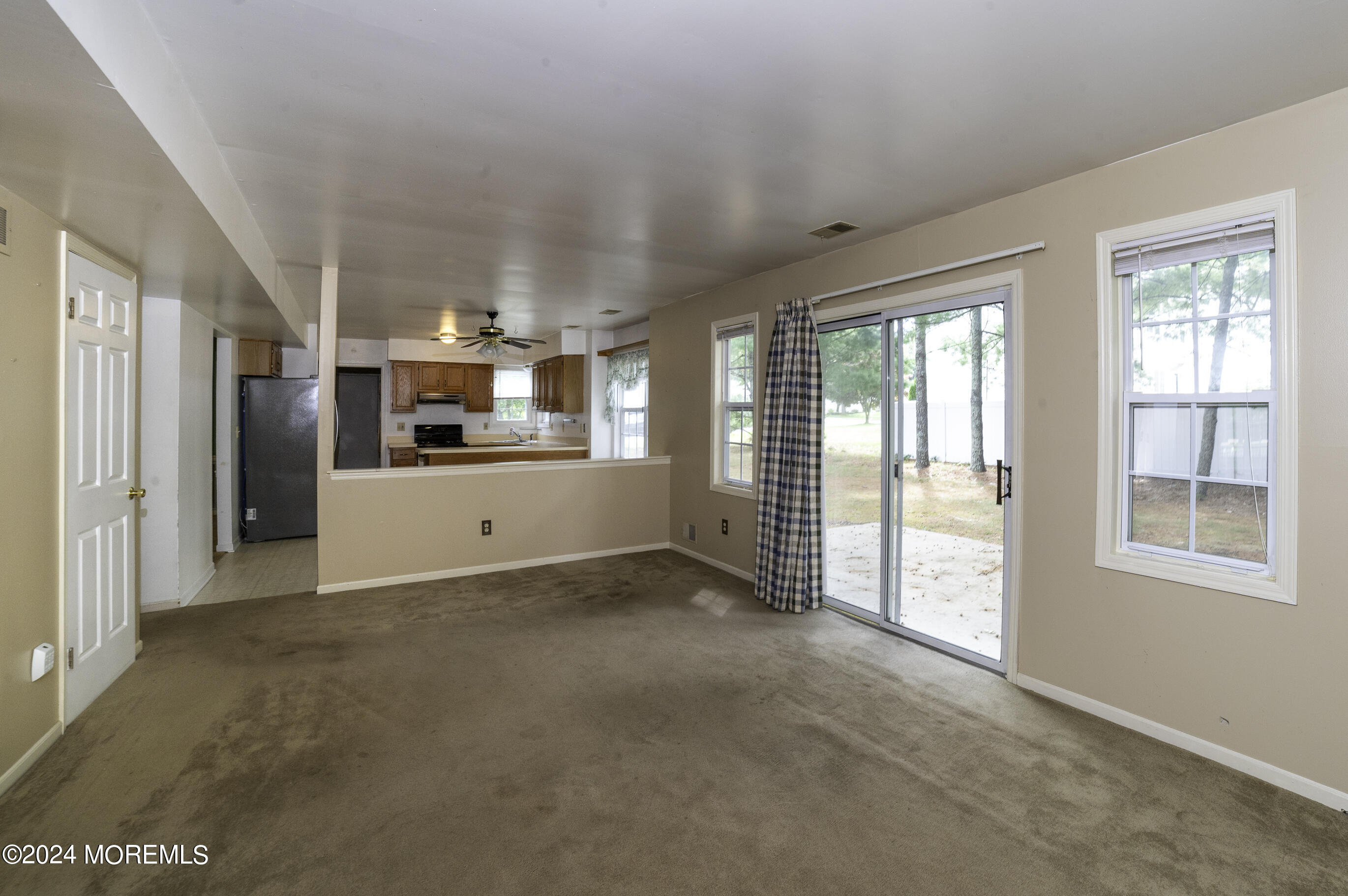 179 Wells Mill Road Waretown, NJ 08758 - Photo 8 of 28 a view of a big room with windows and kitchen view