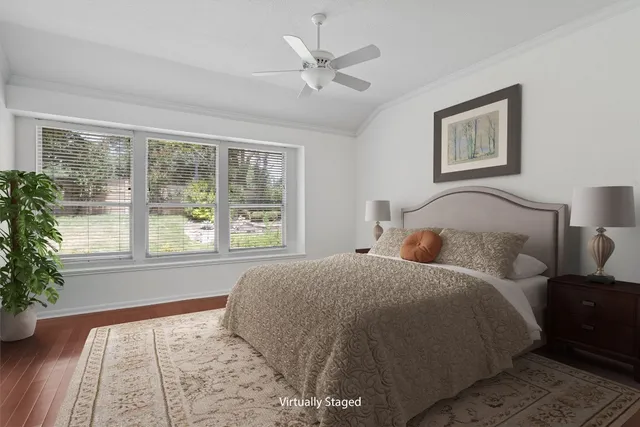 a bed room with a bed and a large window