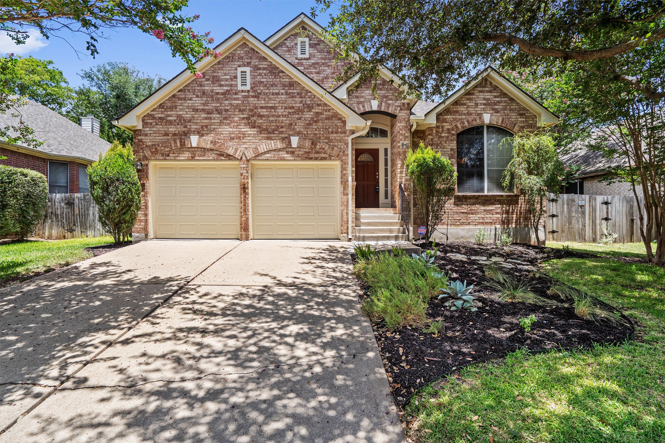 2328 Rodeo Drive Austin, TX 78727 - Photo 2 of 40 a front view of a house with a garden
