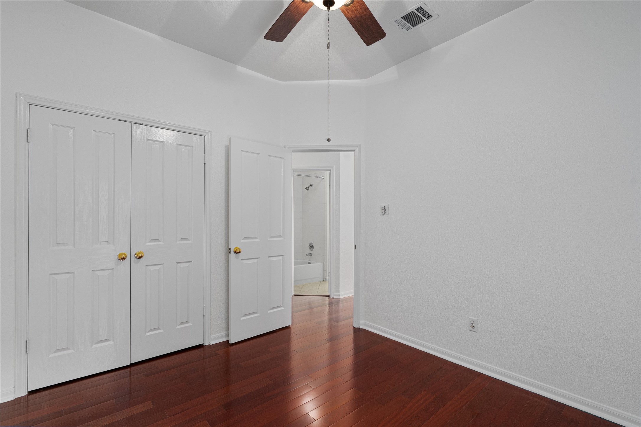 2328 Rodeo Drive Austin, TX 78727 - Photo 29 of 40 a view of an empty room with wooden floor