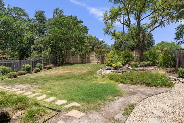 a view of backyard with green space