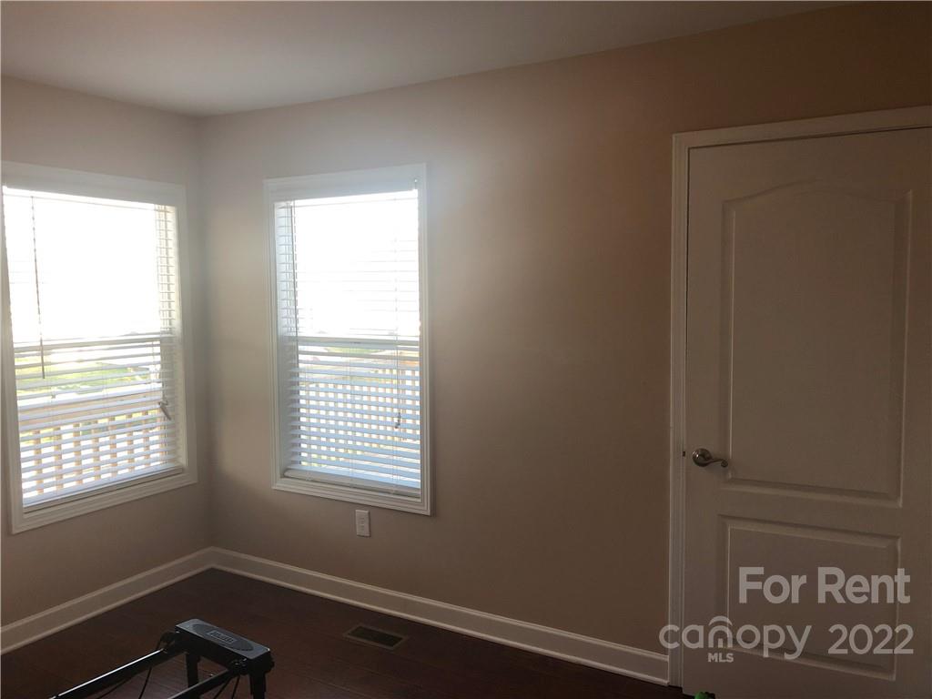 1401 Hickory Grove Road Gastonia, NC 28056 - Photo 5 of 12 a view of an empty room with a window