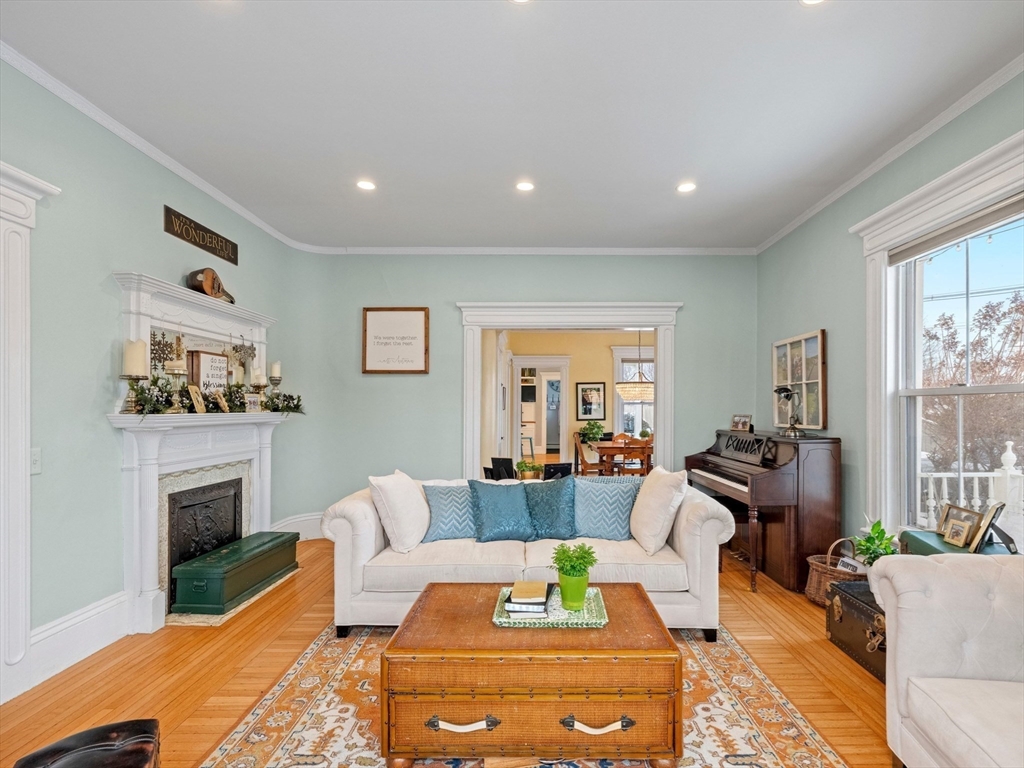 5 Holten Street Danvers, MA 01923 - Photo 16 of 42 a living room with furniture fireplace and window