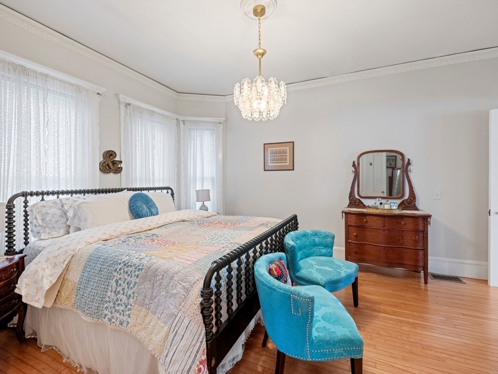 5 Holten Street Danvers, MA 01923 - Photo 19 of 42 a bed room with a bed and a dresser