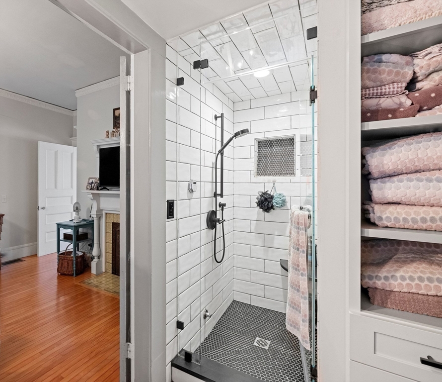5 Holten Street Danvers, MA 01923 - Photo 21 of 42 a bathroom with a walk in closet and a bathroom