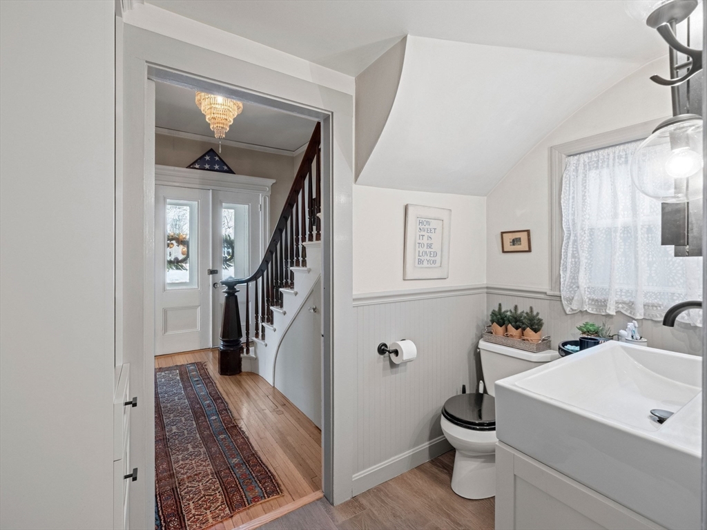 5 Holten Street Danvers, MA 01923 - Photo 22 of 42 a bathroom with a sink a toilet and a mirror