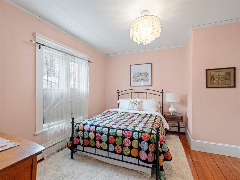 5 Holten Street Danvers, MA 01923 - Photo 23 of 42 a bedroom with a bed and a window