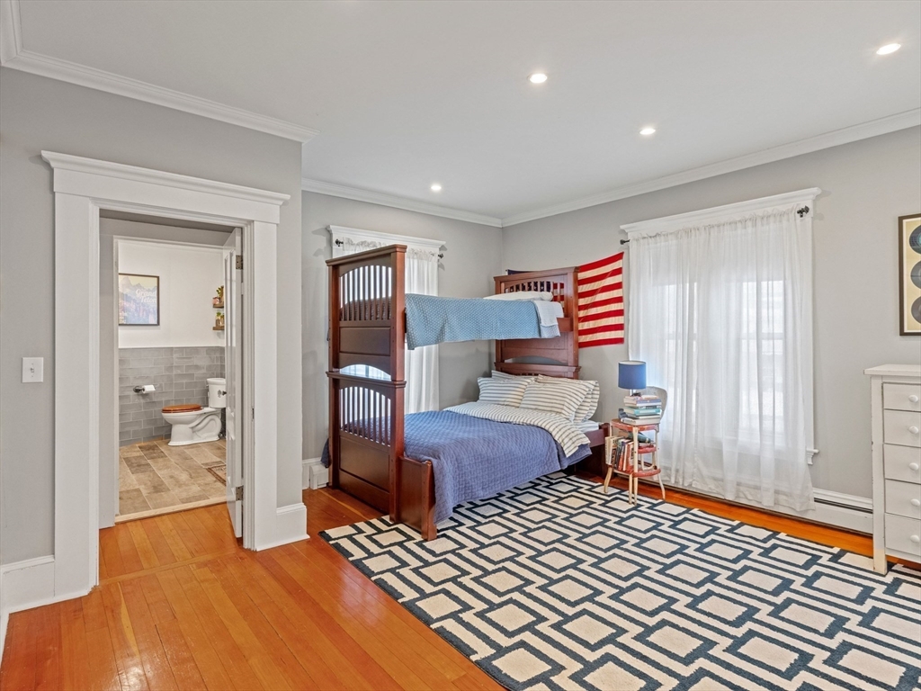 5 Holten Street Danvers, MA 01923 - Photo 26 of 42 a bedroom with a bed and wooden floor
