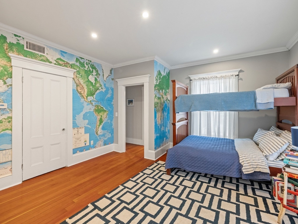 5 Holten Street Danvers, MA 01923 - Photo 27 of 42 a bedroom with a bed and wooden floor