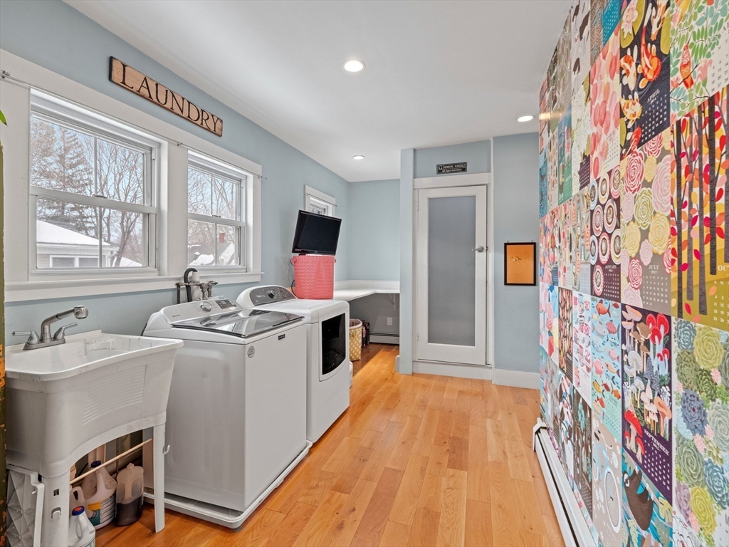 5 Holten Street Danvers, MA 01923 - Photo 30 of 42 a view of a kitchen with fridge and workspace
