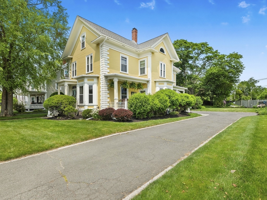 5 Holten Street Danvers, MA 01923 - Photo 3 of 42 a front view of a house with a yard