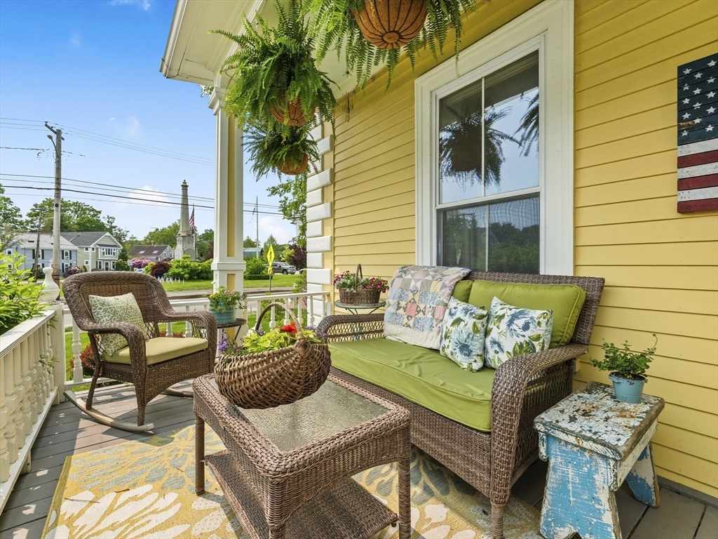 5 Holten Street Danvers, MA 01923 - Photo 35 of 42 a view of a patio with couches table and chairs and potted plants