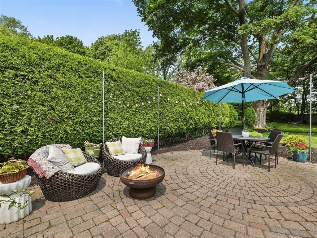 5 Holten Street Danvers, MA 01923 - Photo 39 of 42 an outdoor space with furniture and umbrella