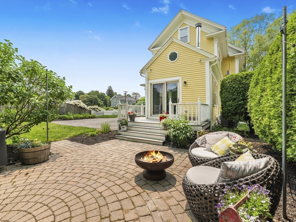 5 Holten Street Danvers, MA 01923 - Photo 40 of 42 a front view of a house with yard and green space