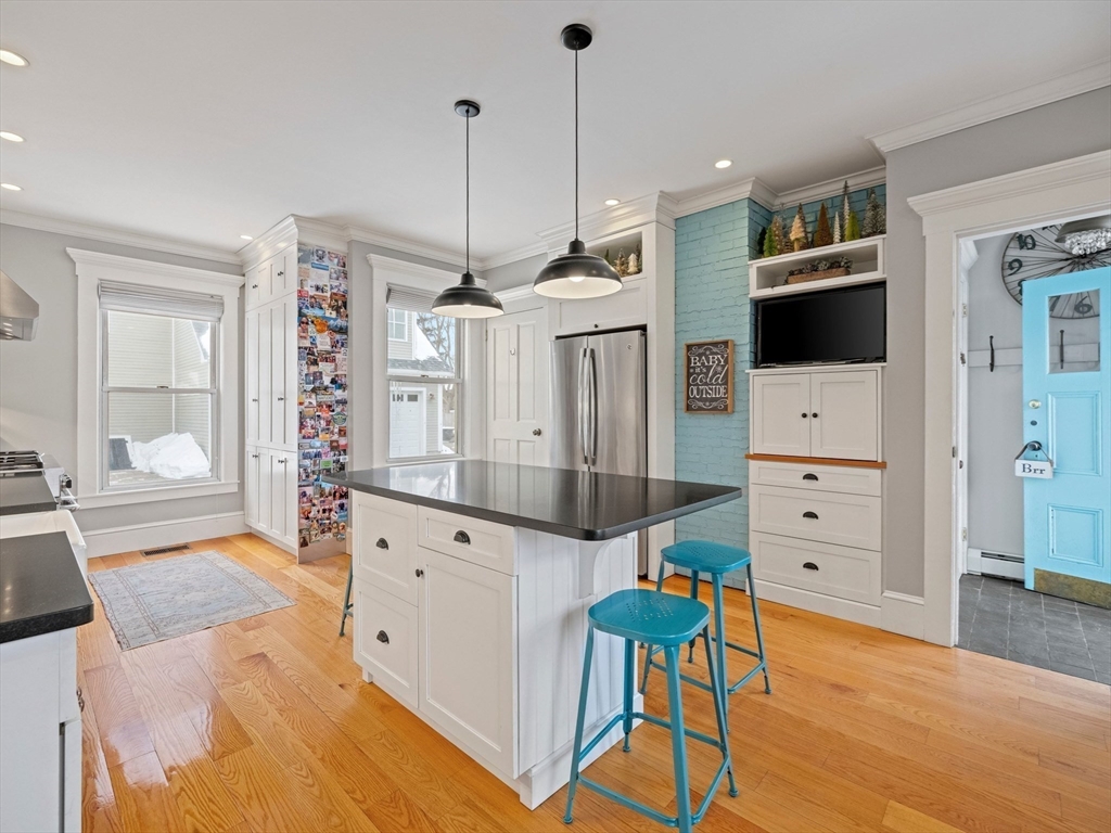 5 Holten Street Danvers, MA 01923 - Photo 5 of 42 a large white kitchen with cabinets