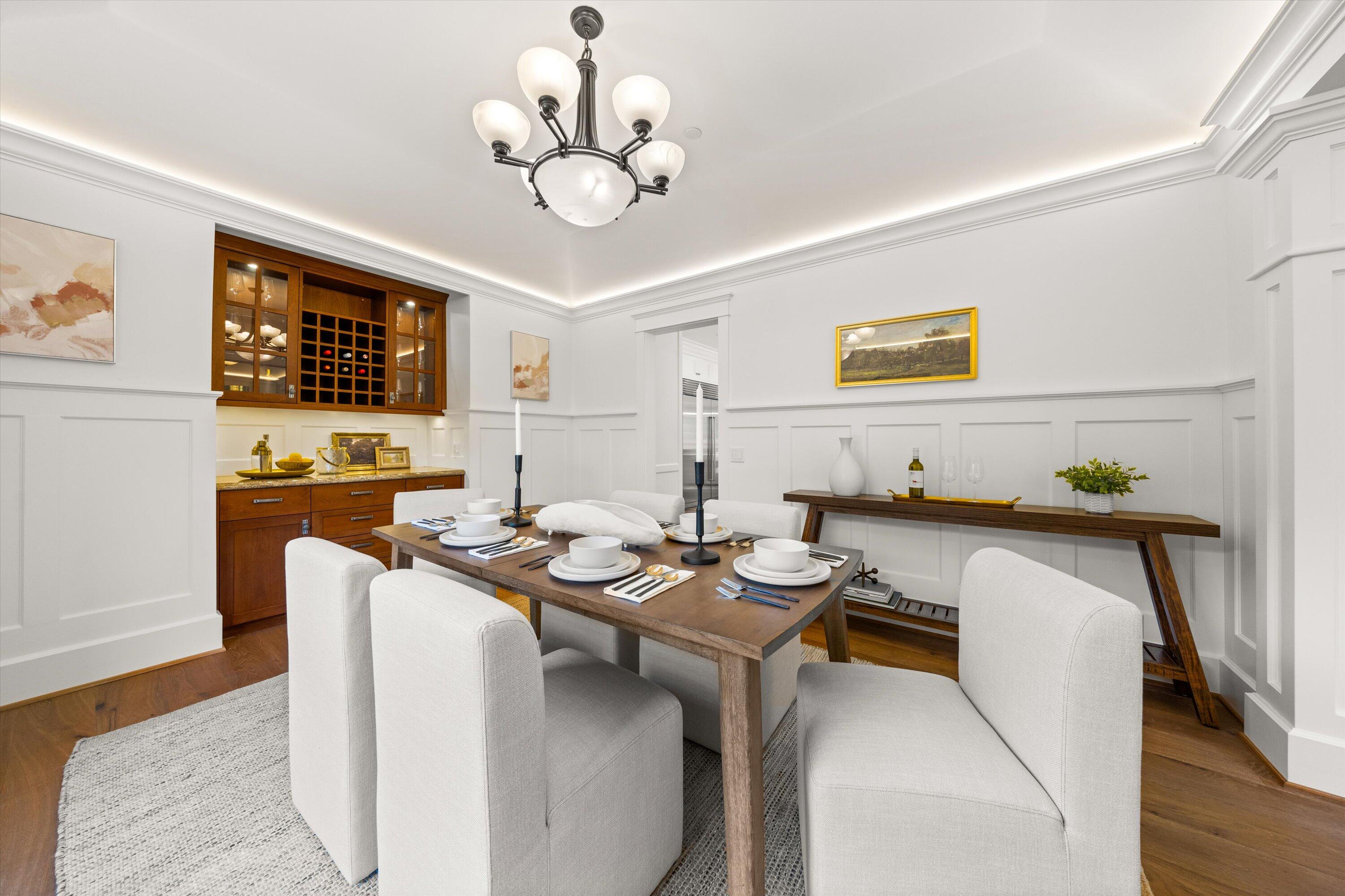155 Santa Isabel Lane Montecito, CA 93108 - Photo 11 of 37 a view of a dining room with furniture and chandelier
