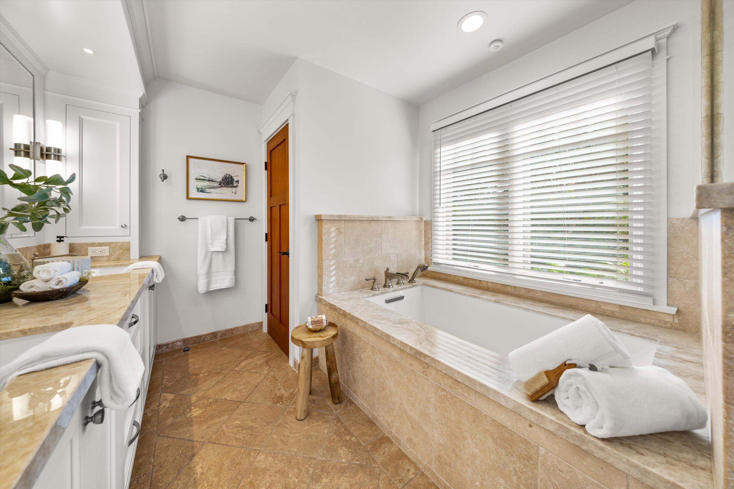 155 Santa Isabel Lane Montecito, CA 93108 - Photo 16 of 37 a spacious bathroom with a tub sink and mirror