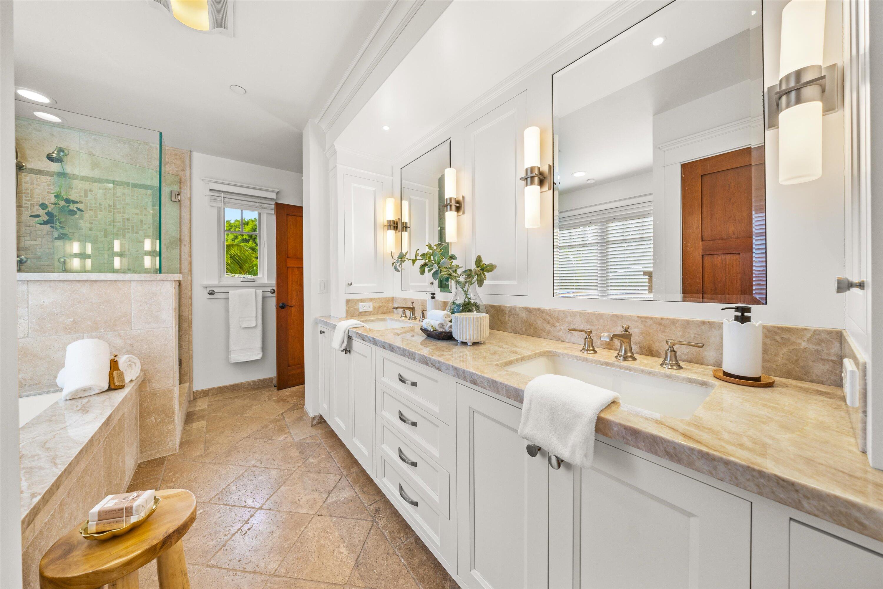 155 Santa Isabel Lane Montecito, CA 93108 - Photo 17 of 37 a bathroom with a granite countertop sink and a mirror