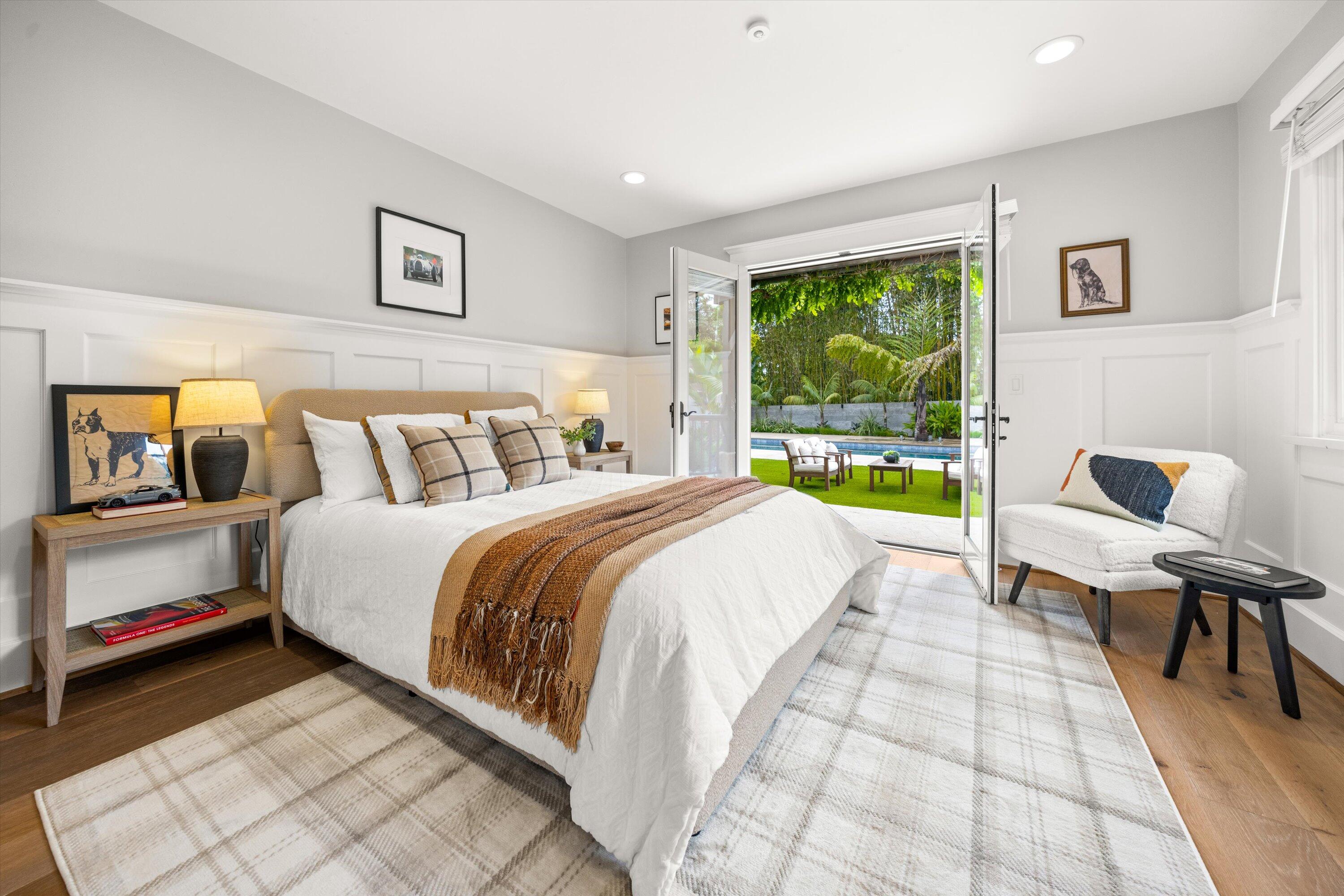 155 Santa Isabel Lane Montecito, CA 93108 - Photo 21 of 37 a spacious bedroom with a bed and a large window