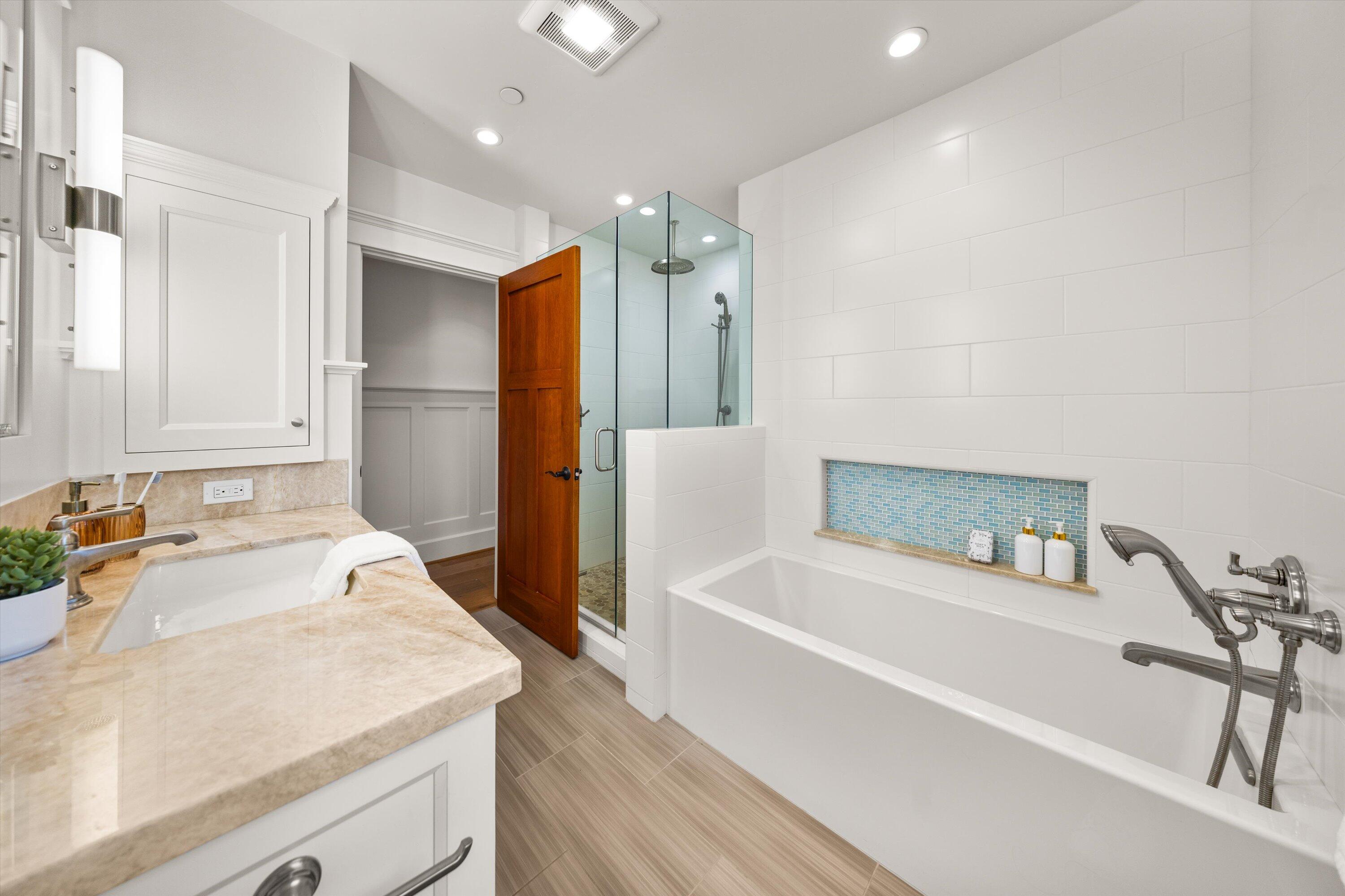 155 Santa Isabel Lane Montecito, CA 93108 - Photo 22 of 37 a spacious bathroom with a tub sink and mirror