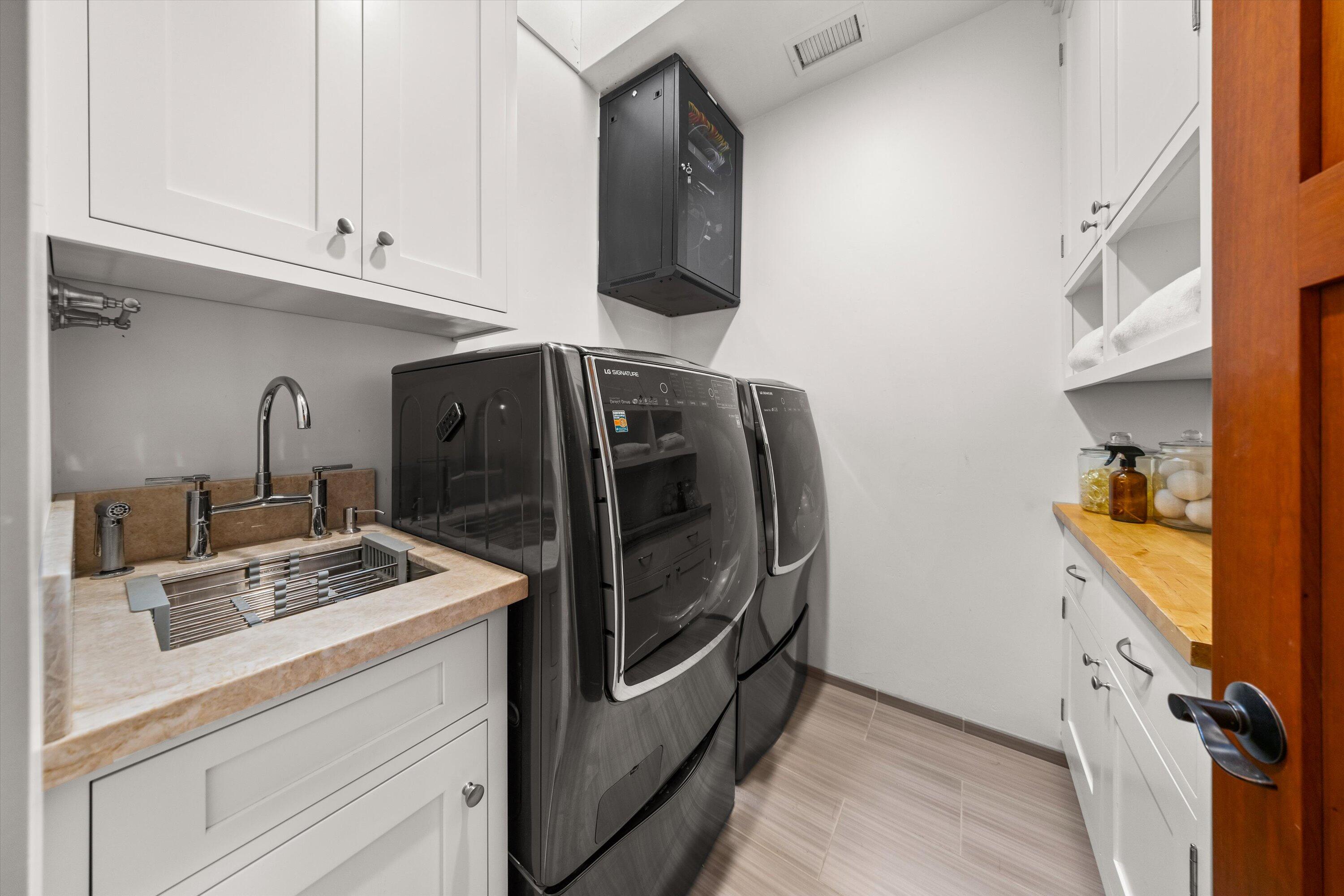 155 Santa Isabel Lane Montecito, CA 93108 - Photo 24 of 37 a kitchen with appliances and cabinets