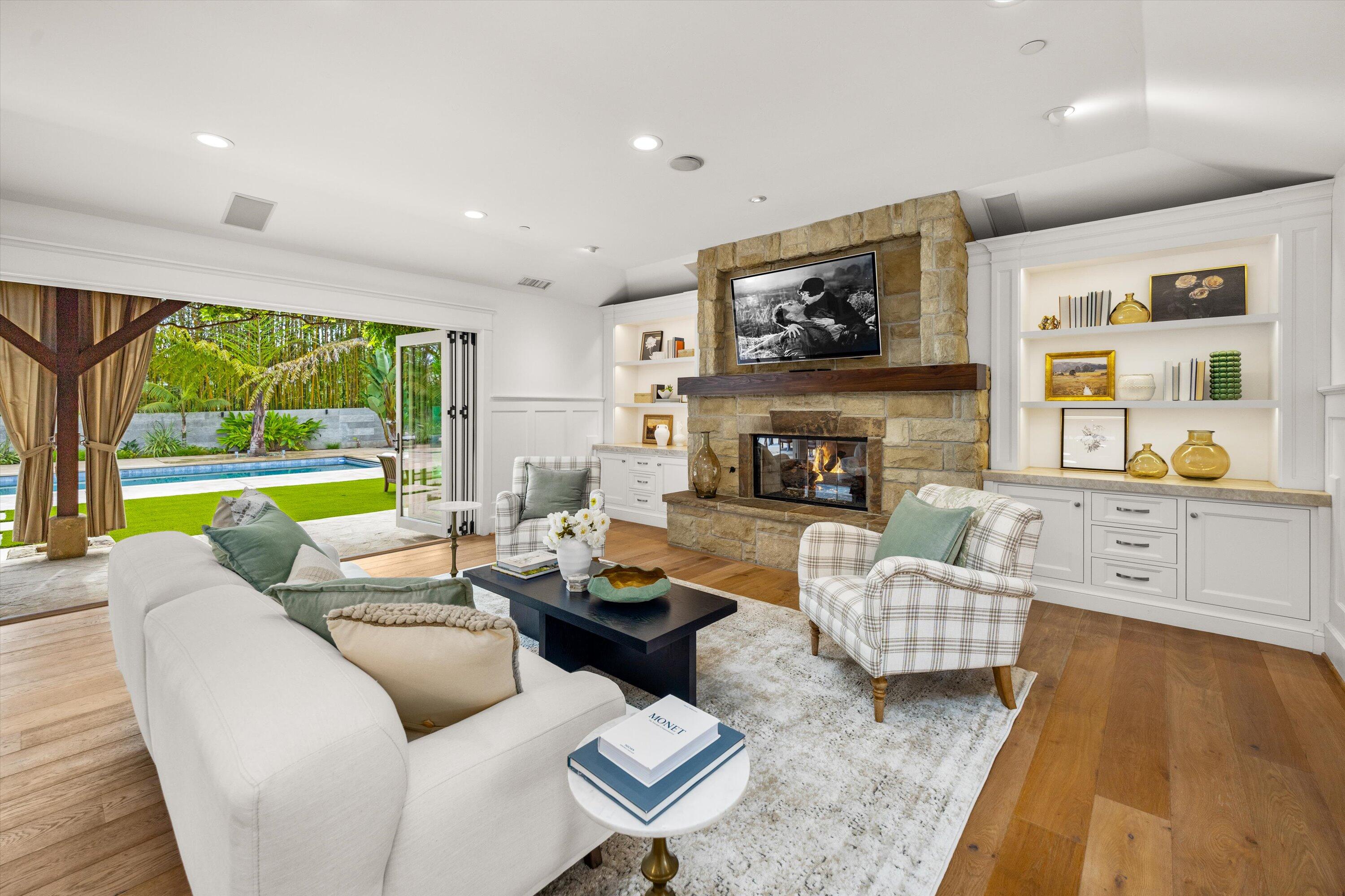 155 Santa Isabel Lane Montecito, CA 93108 - Photo 3 of 37 a living room with fireplace furniture and a large window