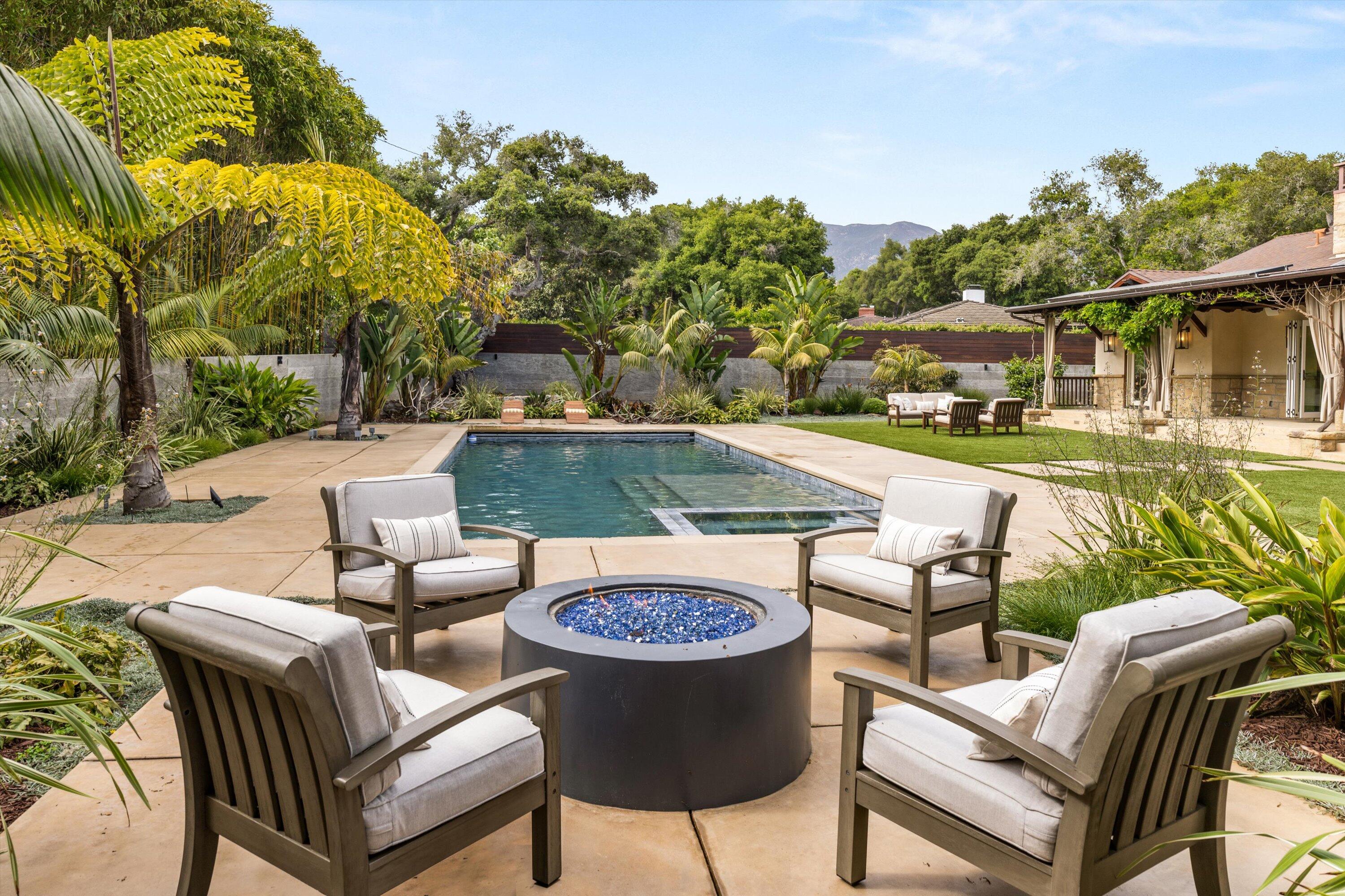 155 Santa Isabel Lane Montecito, CA 93108 - Photo 32 of 37 a view of a patio with table and chairs and potted plants