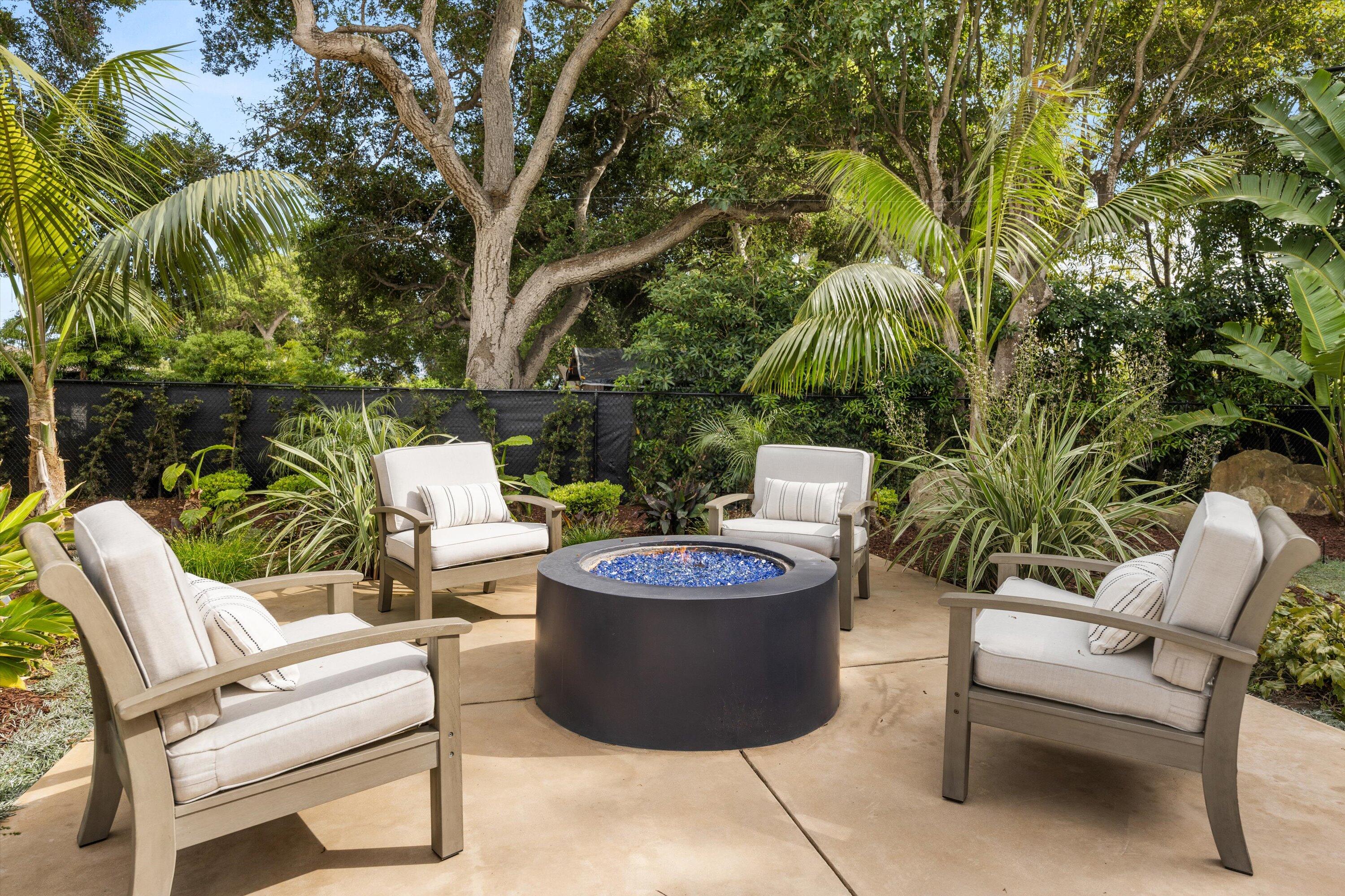 155 Santa Isabel Lane Montecito, CA 93108 - Photo 33 of 37 a view of a backyard with plants and chairs