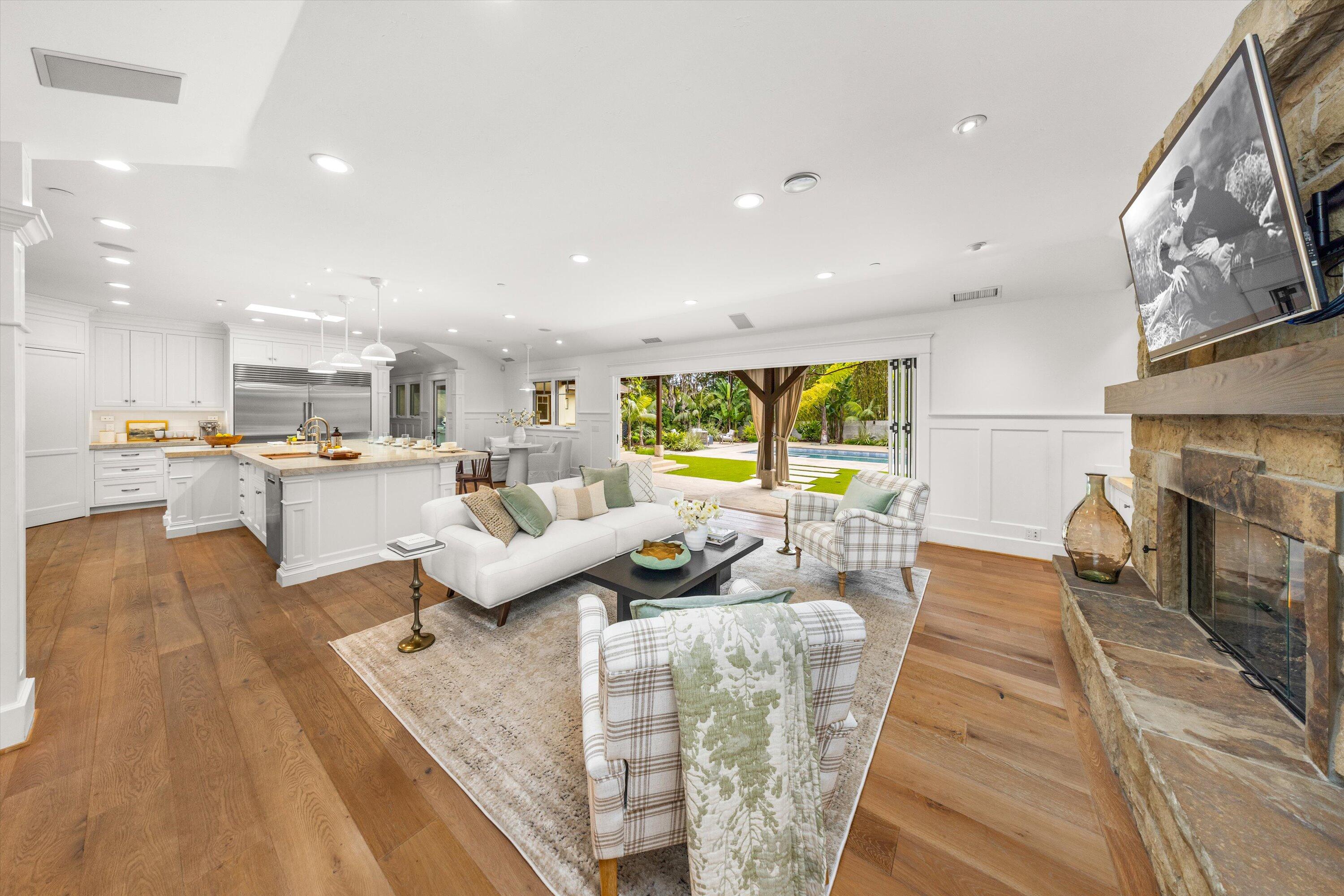 155 Santa Isabel Lane Montecito, CA 93108 - Photo 5 of 37 a living room with furniture and a fireplace