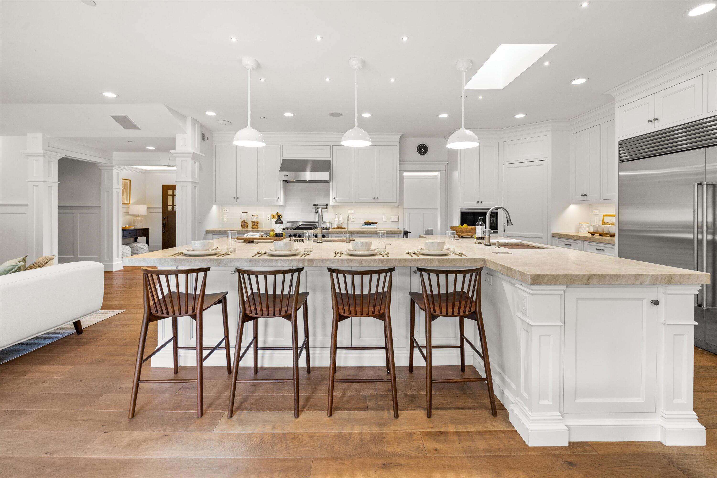 155 Santa Isabel Lane Montecito, CA 93108 - Photo 8 of 37 a large kitchen with a table and chairs