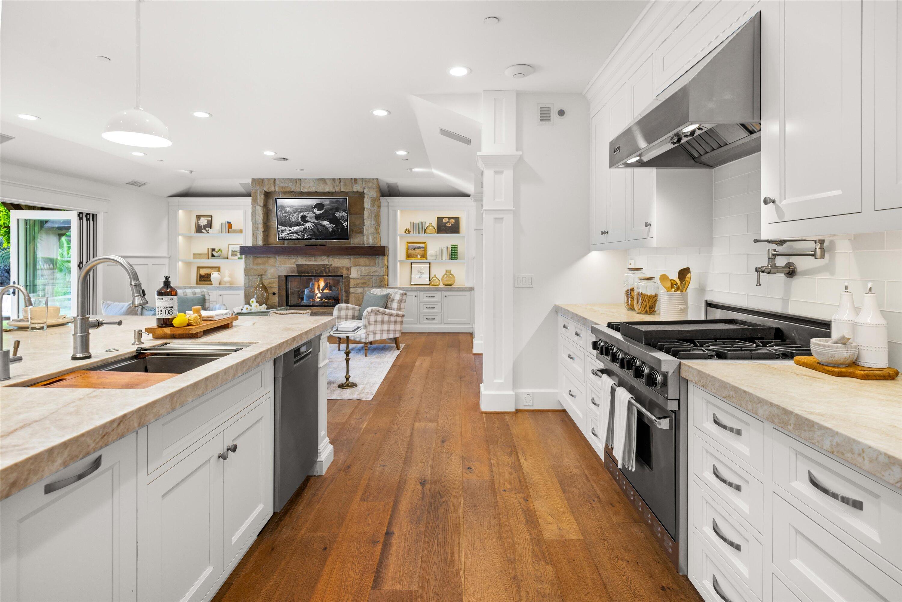 155 Santa Isabel Lane Montecito, CA 93108 - Photo 9 of 37 a large kitchen with stainless steel appliances granite countertop a lot of counter space and wooden floors