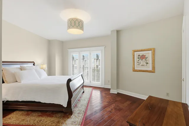 a bedroom with a bed and a lamp