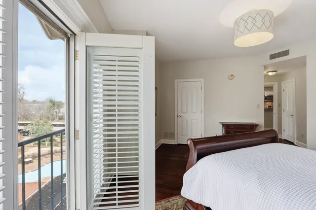 a view of washer and dryer with wooden floor