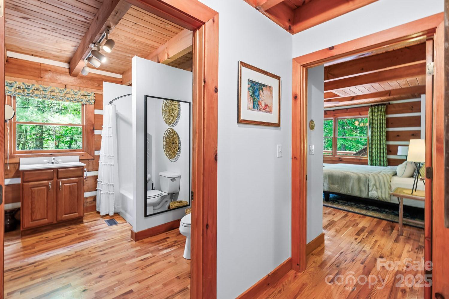 1745 Sugar Camp Road Marshall, NC 28753 - Photo 11 of 41 a bedroom with wooden floor and a window