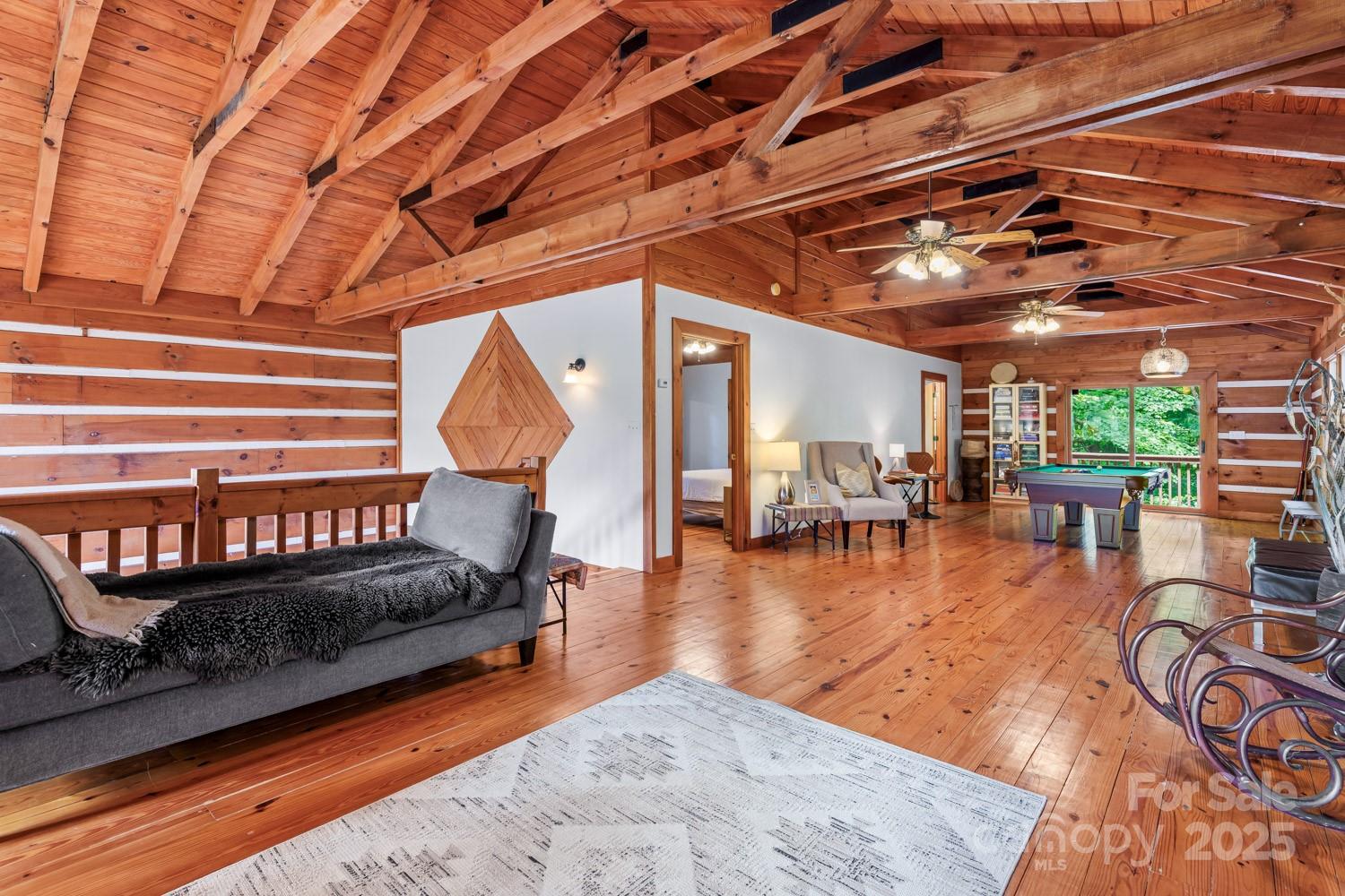 1745 Sugar Camp Road Marshall, NC 28753 - Photo 15 of 41 a room with lots of furniture and a rug