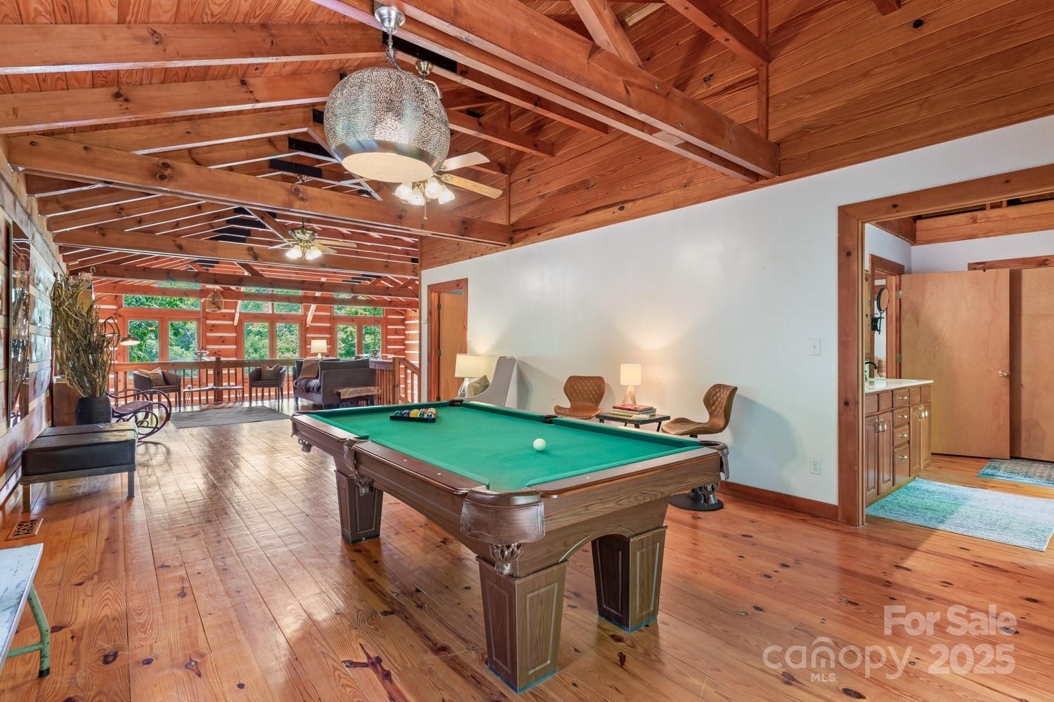 1745 Sugar Camp Road Marshall, NC 28753 - Photo 18 of 41 a room with pool table and wooden floor